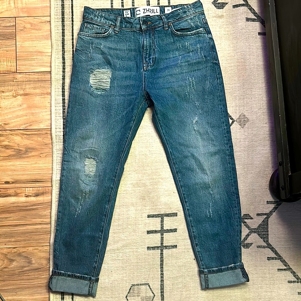 Woman’s Zhrill Blue Denim Jeans with Distressed Details. Size 29W.
